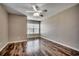 Bedroom with natural light, wood-look flooring, and neutral paint at 504 Lake Shore Dr., Surfside Beach, SC 29575