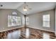 Bright bedroom featuring high ceilings, a ceiling fan, and large windows at 504 Lake Shore Dr., Surfside Beach, SC 29575