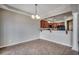 Open dining area featuring tile floors, decorative lighting fixture and views of the kitchen with granite countertops at 504 Lake Shore Dr., Surfside Beach, SC 29575