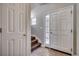 Bright foyer features tile flooring, a front door with glass, and staircase access at 504 Lake Shore Dr., Surfside Beach, SC 29575