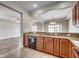 Open kitchen featuring granite countertops, dark cabinets, and modern appliances at 504 Lake Shore Dr., Surfside Beach, SC 29575