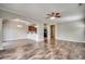Open concept living space with hardwood floors and view to kitchen and dining areas at 504 Lake Shore Dr., Surfside Beach, SC 29575