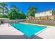 Refreshing community pool surrounded by well-maintained landscaping and fencing at 504 Lake Shore Dr., Surfside Beach, SC 29575