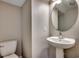 Compact powder room with pedestal sink and toilet at 504 Lake Shore Dr., Surfside Beach, SC 29575