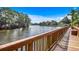 Picturesque waterfront view from a wooden walkway, showcasing the tranquil and scenic location at 504 Lake Shore Dr., Surfside Beach, SC 29575