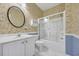 Cozy bathroom featuring a patterned wallpaper and a glass-door shower at 5042 Forsythia Circle # 5042, Murrells Inlet, SC 29576