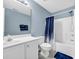 Bathroom with shower, toilet, vanity and bright blue accent wall at 5042 Forsythia Circle # 5042, Murrells Inlet, SC 29576