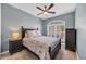 Comfortable bedroom featuring a dark-wood bed frame and large window at 5042 Forsythia Circle # 5042, Murrells Inlet, SC 29576