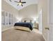 Inviting bedroom with vaulted ceiling, neutral walls, and a cozy bed with blue bedding at 5042 Forsythia Circle # 5042, Murrells Inlet, SC 29576