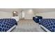 Bedroom with two beds, a TV, and a blue couch at 5042 Forsythia Circle # 5042, Murrells Inlet, SC 29576