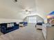 Bedroom with two beds, a tv, couch, carpet, and a ceiling fan at 5042 Forsythia Circle # 5042, Murrells Inlet, SC 29576