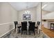 Elegant dining room with a modern chandelier, a large table, and stylish decor for gatherings at 5042 Forsythia Circle # 5042, Murrells Inlet, SC 29576