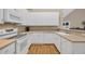 Well-lit kitchen featuring white cabinets, modern appliances, and plenty of counter space for meal prep at 5042 Forsythia Circle # 5042, Murrells Inlet, SC 29576