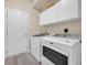 Laundry room with a Maytag washer and dryer, with cabinets at 5042 Forsythia Circle # 5042, Murrells Inlet, SC 29576