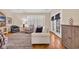 Bright living room with hardwood floors, a cozy seating arrangement, and natural light through the windows at 5042 Forsythia Circle # 5042, Murrells Inlet, SC 29576