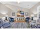 Cozy living room featuring vaulted ceilings, stylish seating, and a large television at 5042 Forsythia Circle # 5042, Murrells Inlet, SC 29576