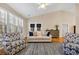 Bright living room with neutral sofa, patterned armchairs, and shuttered windows at 5042 Forsythia Circle # 5042, Murrells Inlet, SC 29576