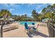 Inviting community pool area with lounge chairs, tables and landscaped surroundings at 5042 Forsythia Circle # 5042, Murrells Inlet, SC 29576