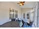 Bright sunroom with furniture, ceiling fan and glass panel doors at 5042 Forsythia Circle # 5042, Murrells Inlet, SC 29576