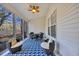 Bright sunroom with furniture, ceiling fan and large windows at 5042 Forsythia Circle # 5042, Murrells Inlet, SC 29576