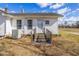 Exterior shot of a home showing weathered deck and grassy backyard at 5092 Harrelson Ave., Loris, SC 29569