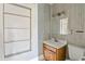A bathroom with a light wood cabinet and a toilet next to it at 5092 Harrelson Ave., Loris, SC 29569
