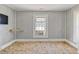 Bedroom with wallpaper and a small window with a window air conditioning unit at 5092 Harrelson Ave., Loris, SC 29569
