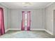 A bedroom with wallpaper and purple curtains at 5092 Harrelson Ave., Loris, SC 29569
