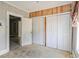 Bedroom with multiple closets and an open doorway showing the rest of the house at 5092 Harrelson Ave., Loris, SC 29569