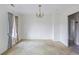 A dining room with peeling paint and a view into another room at 5092 Harrelson Ave., Loris, SC 29569