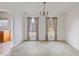A dining room with peeling paint and colorful curtains at 5092 Harrelson Ave., Loris, SC 29569