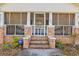 Close up of the inviting front porch of a home with brick accents and steps at 5092 Harrelson Ave., Loris, SC 29569