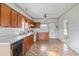 Functional kitchen featuring wooden cabinets, a double sink, and a window above the sink at 5092 Harrelson Ave., Loris, SC 29569