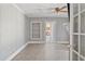 Living room showcasing an open doorway, built in shelving, and fireplace at 5092 Harrelson Ave., Loris, SC 29569