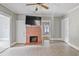 Living room showcasing a brick fireplace and doorway to another room at 5092 Harrelson Ave., Loris, SC 29569