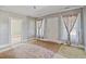 Inviting living room featuring vintage floral curtains and a doorway leading to another room at 5092 Harrelson Ave., Loris, SC 29569