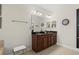 Bathroom features a granite countertop and a large mirror over the double vanity at 518 Heartland Ct., Murrells Inlet, SC 29576