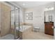 Bright bathroom with a glass-enclosed shower, a soaking tub, and a double sink vanity at 518 Heartland Ct., Murrells Inlet, SC 29576