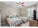 Comfortable bedroom with two twin beds, ceiling fan, and neutral decor creating a calming space at 518 Heartland Ct., Murrells Inlet, SC 29576