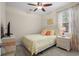Cozy bedroom featuring bright yellow accents, a ceiling fan, and natural light from the window at 518 Heartland Ct., Murrells Inlet, SC 29576