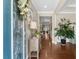 Welcoming entryway with hardwood floors, decorative accents, and a view into the home's living spaces at 518 Heartland Ct., Murrells Inlet, SC 29576
