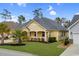 Charming single-story home with a covered front porch and manicured lawn at 518 Heartland Ct., Murrells Inlet, SC 29576