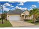 Charming single-story home with a well-manicured lawn, a two-car garage, and attractive landscaping at 518 Heartland Ct., Murrells Inlet, SC 29576