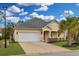 Charming single-story home showcasing a well-manicured lawn, driveway, and an attached two-car garage at 518 Heartland Ct., Murrells Inlet, SC 29576