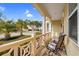 Cozy front porch featuring comfortable seating and views of the manicured lawn and peaceful neighborhood at 518 Heartland Ct., Murrells Inlet, SC 29576