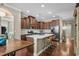 Stylish kitchen with an island, stainless steel appliances, dark cabinetry, and a cozy breakfast bar at 518 Heartland Ct., Murrells Inlet, SC 29576