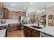 Spacious kitchen featuring stainless steel appliances, wooden cabinets, and granite countertops at 518 Heartland Ct., Murrells Inlet, SC 29576