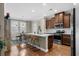 Modern kitchen with an island, stainless steel appliances, and a breakfast nook with large windows at 518 Heartland Ct., Murrells Inlet, SC 29576