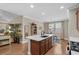 Kitchen island with stainless steel appliances, stylish countertops, and dark wood cabinets at 518 Heartland Ct., Murrells Inlet, SC 29576