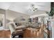 Bright living room with hardwood floors, a sectional sofa, and seamless access to the kitchen area at 518 Heartland Ct., Murrells Inlet, SC 29576